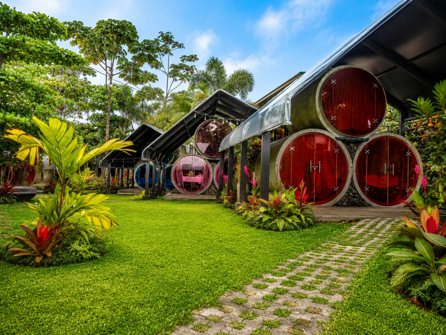 Colorful cylindrical rooms along the garden path